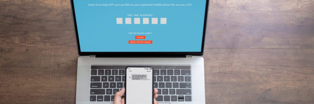 Woman hand enter a one time password for the validation process